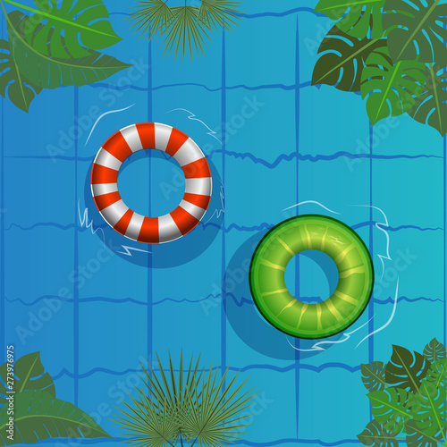 Pool party, rubber ring floating on water . Relaxing in  summer resort,