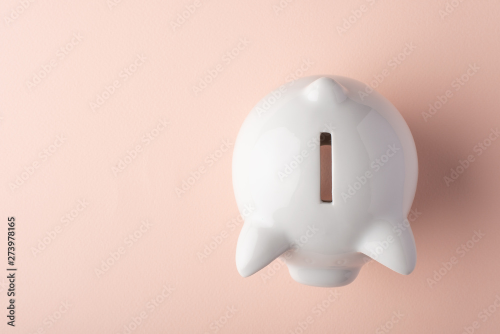 Gilt piggy bank on a light background. Money saving concept. Saving. view from above Gilt piggy bank on a light background. Money saving concept. Saving. view from above