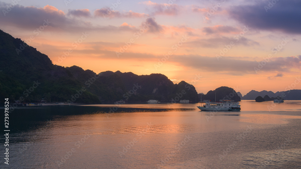 Tourist Junks in Halong Bay,Panoramic view of sunset in Halong Bay, Vietnam, Southeast Asia
