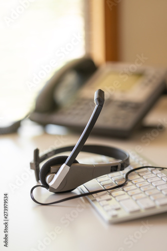 Obraz na plátne headset headset phone and keyboard talk, support, communication, call center and