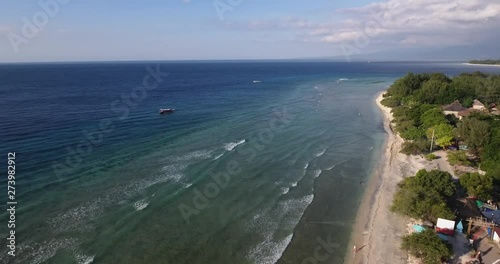 Wallpaper Mural Aerial view, flying over gili trawangan beach, lombok, bali, indonesia. views of coastline, coral reefs, small boats in the ocean, tropical summer vacation vibes. Torontodigital.ca