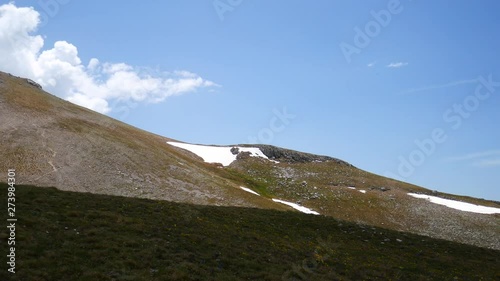 snow on the mountains of Roccaraso in summer, (plateau) Piano Aremogna and Pizzalto, Monte Greco, Monti Marsicani highest group of Apennines. L'Aquila, Abruzzo, Italy photo