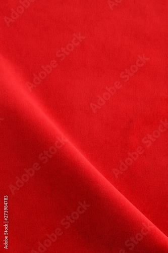 velvet fabric texture background red color. Christmas festive baskground. expensive luxury, material, cloth.Copy space.