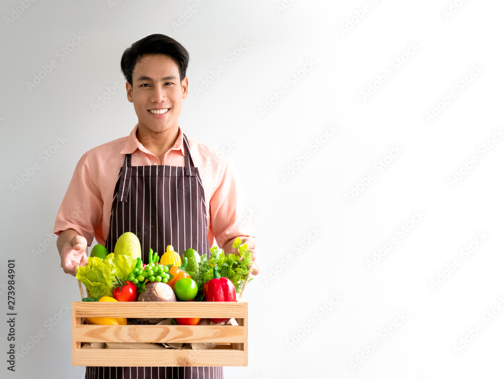 Farmer harvest and hold fresh vegetable for healthy life in wooden box set with white copy space for business Farmer harvest and hold fresh vegetable for healthy life in wooden box set with white copy space for business