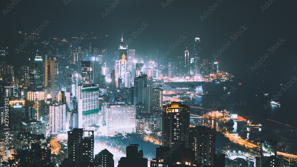 Hong Kong Island night view in a teal & orange colour tone from Braemar hill. A destination viewpoint to observe Victoria Harbour & Hong Kong city skyline.