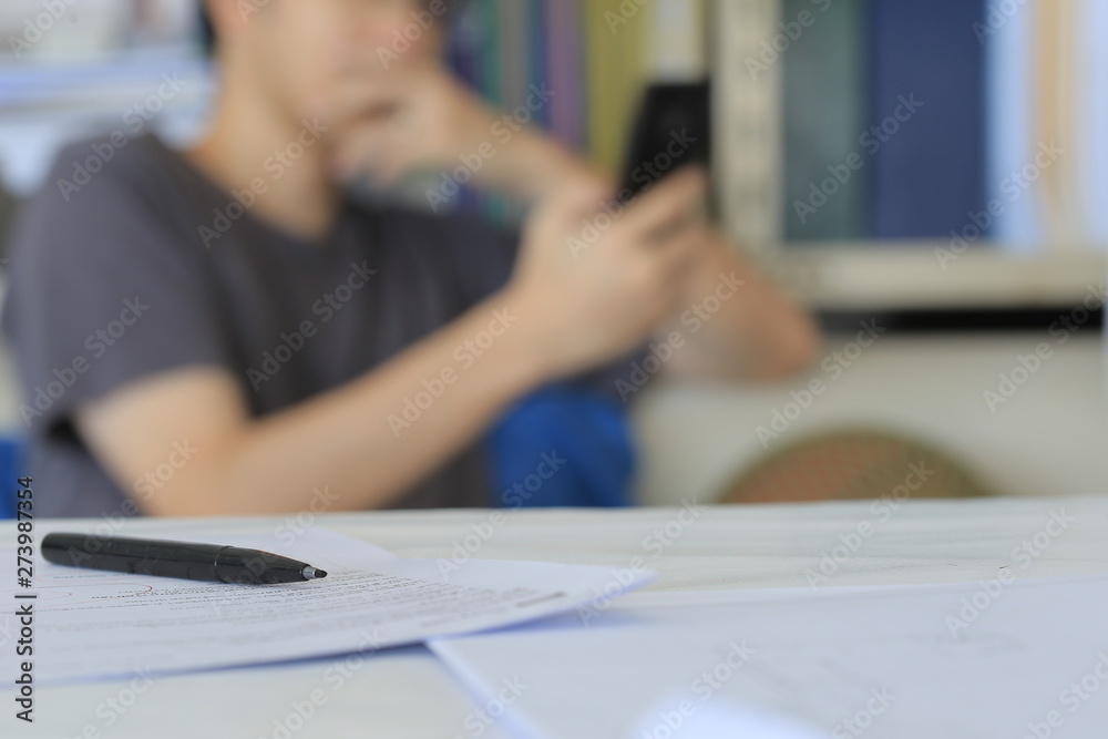blurred man reading message on smartphone