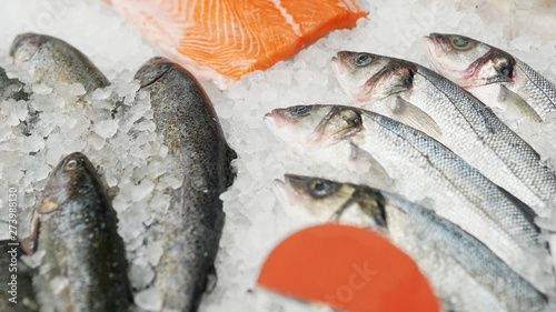 frozen fish in boxes in supermarket or store