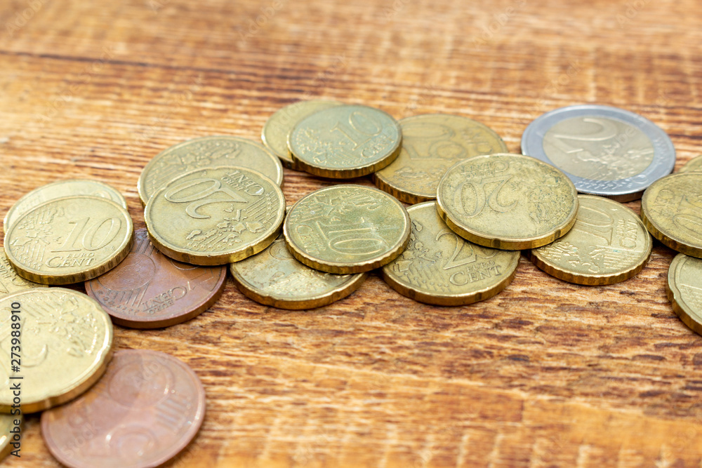 coins Pile pack heap on a wooden background with space for an inscription copy space mock up selective focus close up coins Pile pack heap on a wooden background with space for an inscription copy space mock up selective focus close up