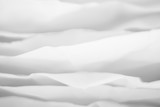 Closeup of white paper layers stack abstract art background. Blur clouds effect. Copy space.