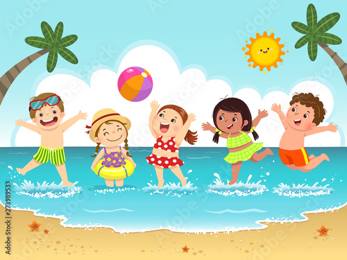 Group of happy kids having fun and splashing on the beach.