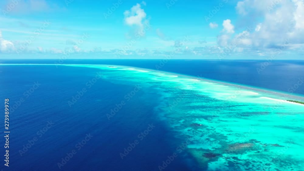 Flying high above a long strip of turquoise water with sandbanks and islands. Surrounded by the deep blue Caribbean Sea. Wide angle, dolly in Flying high above a long strip of turquoise water with sandbanks and islands. Surrounded by the deep blue Caribbean Sea. Wide angle, dolly in