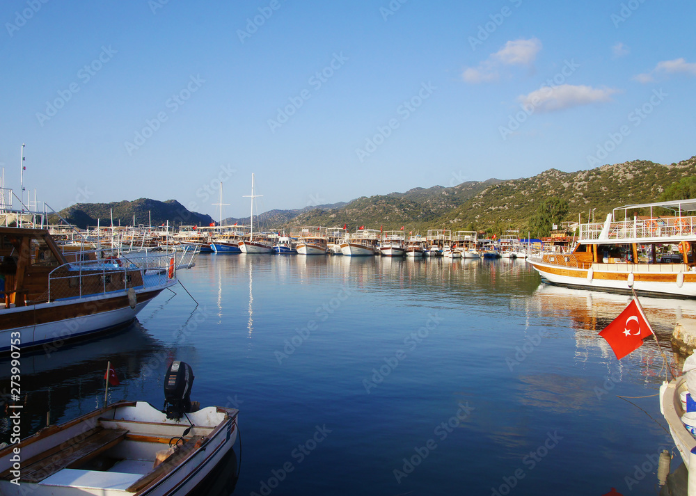 Fishing wharf shipyard with yachts and boats in the Turkish countryside.