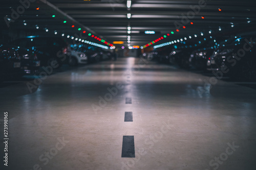 Indoor underground parking lot with blurred background low shot and perspective