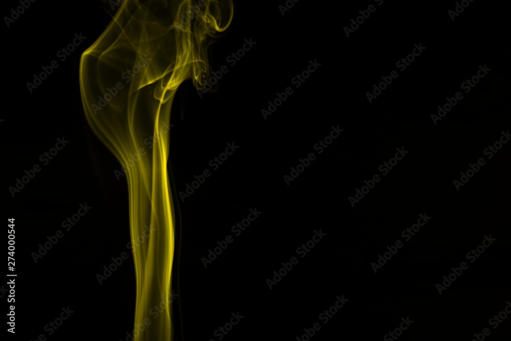 Yellow smoke on black background Yellow smoke on black background