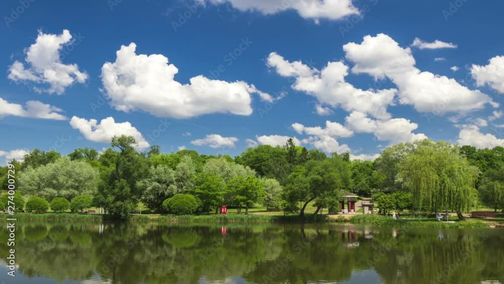 Cumulonimbus clouds over lake, city lake in Minsk, time lapse. Cumulonimbus clouds over lake, city lake in Minsk, time lapse.
