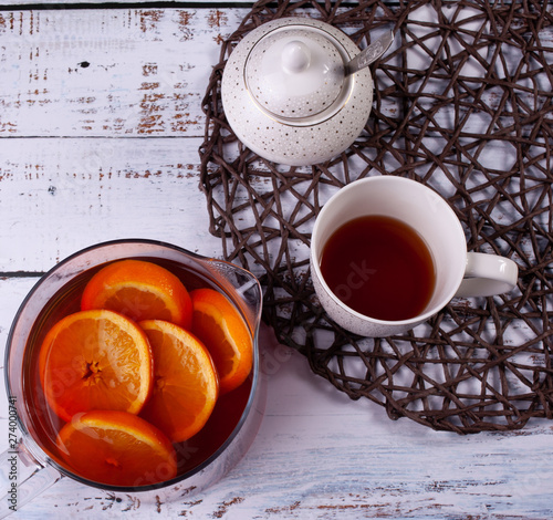 cup of tea with orange and sugar