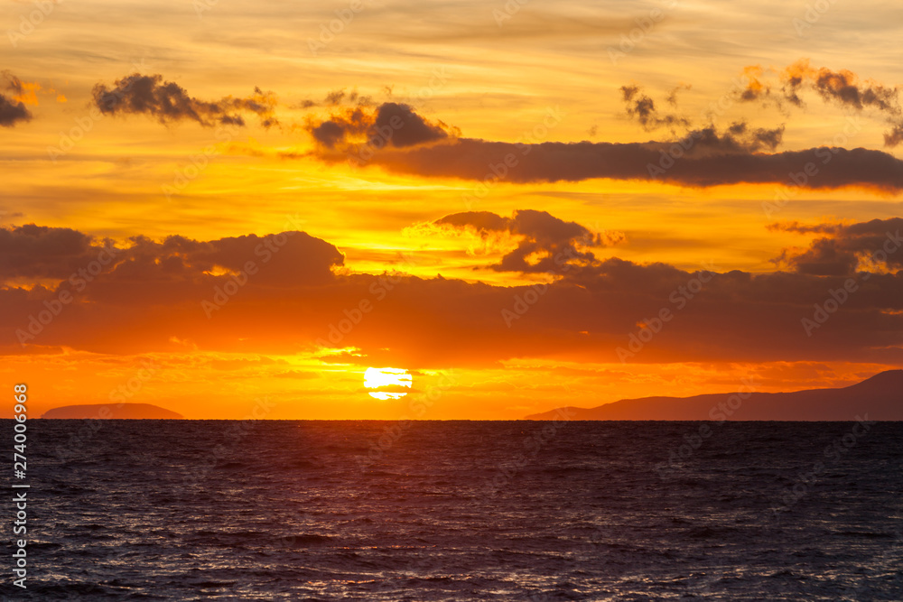 Fototapeta premium Sunrise or sunset over sea surface