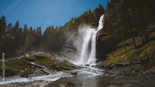 Wild waterfall in summer nature
