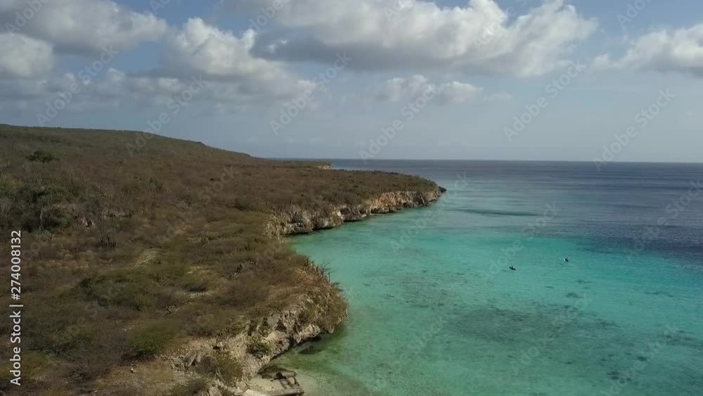 Drone aerial slow motion shot of the caribbean paradise beach Playa Porto Marie in Curacao - Drone aerial slow motion shot of the caribbean paradise beach Playa Porto Marie in Curacao -