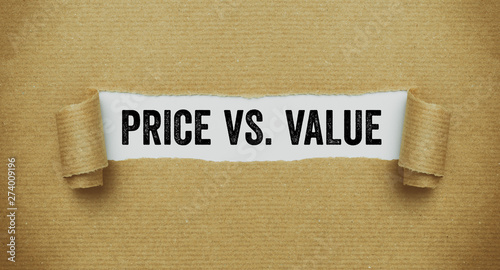 Torn brown paper revealing the words Price vs Value