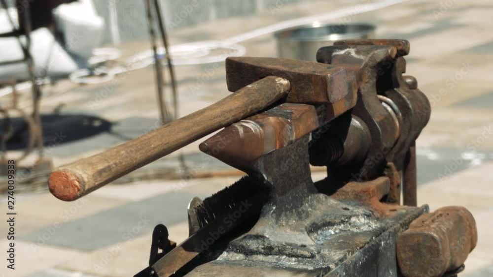 Workplace blacksmith. Anvil, hammers, tongs. Forge on the street. Close-up. Workplace blacksmith. Anvil, hammers, tongs. Forge on the street. Close-up.