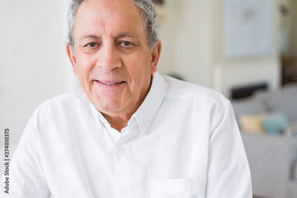 Handsome senior man smiling confident