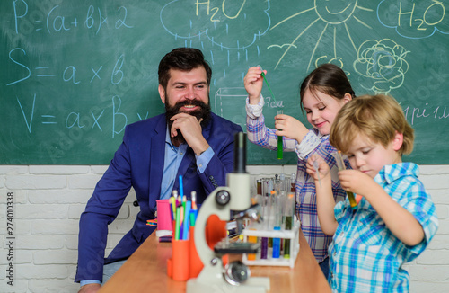 Early development of children. microscope optical instrument at science classroom. happy children & teacher. back to school. learn using microscope at school lesson. Where little things mean a lot