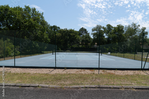 outdoor empty tennis court blue and green