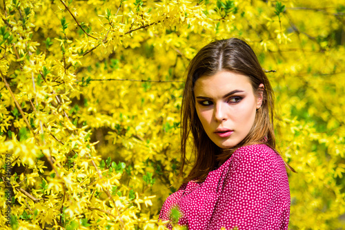 natural beauty makeup. hair fashion. fashion beauty. sexy woman in spring blossom. pretty woman skincare. girl like nature. summer blooming trees and yellow flowers. Allergic to pollen of flowers