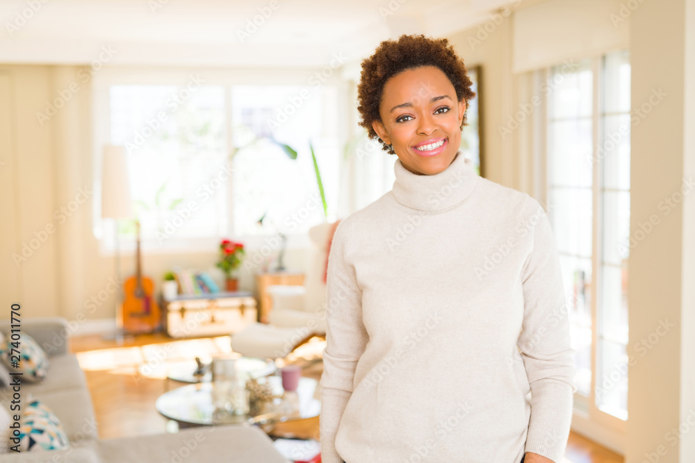 Beautiful young african american woman smiling confident to the camera showing teeth Beautiful young african american woman smiling confident to the camera showing teeth