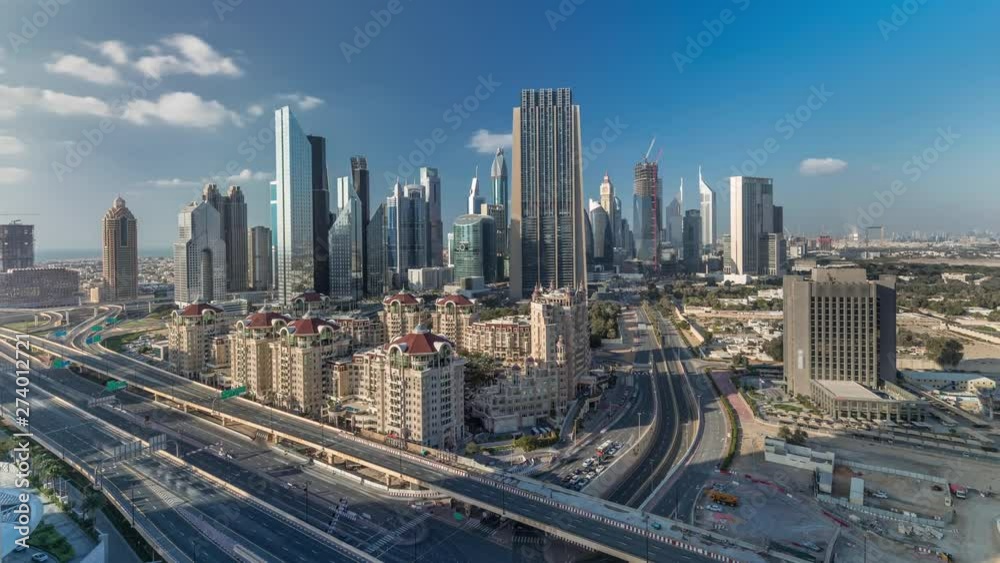 Skyline view of the buildings of Sheikh Zayed Road and DIFC timelapse in Dubai, UAE. Skyscrapers in financial centre aerial view from above in downtown Skyline view of the buildings of Sheikh Zayed Road and DIFC timelapse in Dubai, UAE. Skyscrapers in financial centre aerial view from above in downtown