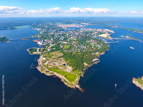 Summer aerial photography with drone. Island and sea bays, water and boat. Finland city of Kotka. Skyline photo