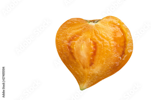 halved tomato in the shape of a heart isolated on white background. the symbol of vegetarian diet, vegan and healthy eating.