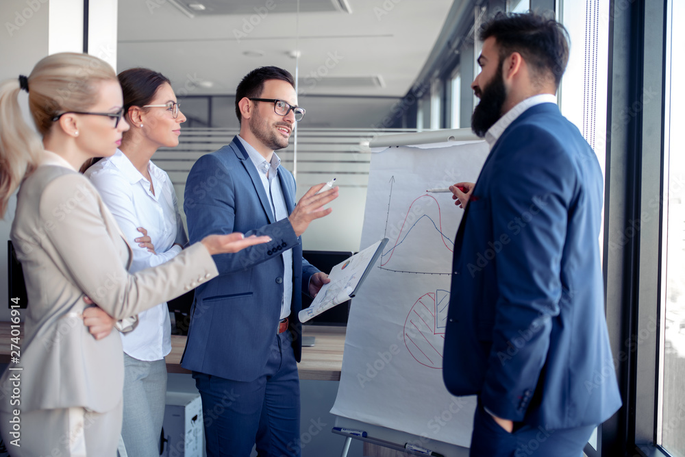 Businessman giving presentation to his colleagues Businessman giving presentation to his colleagues