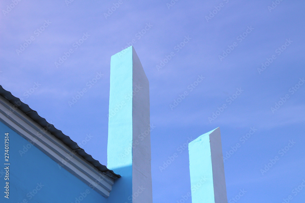 white vertical columns rush into the blue sky. Abstract architectural modern photo white vertical columns rush into the blue sky. Abstract architectural modern photo
