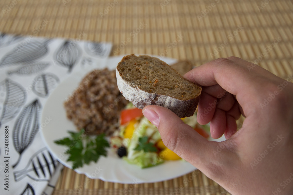 Fototapeta premium Buckwheat salad with cabbage, peppers, black olives