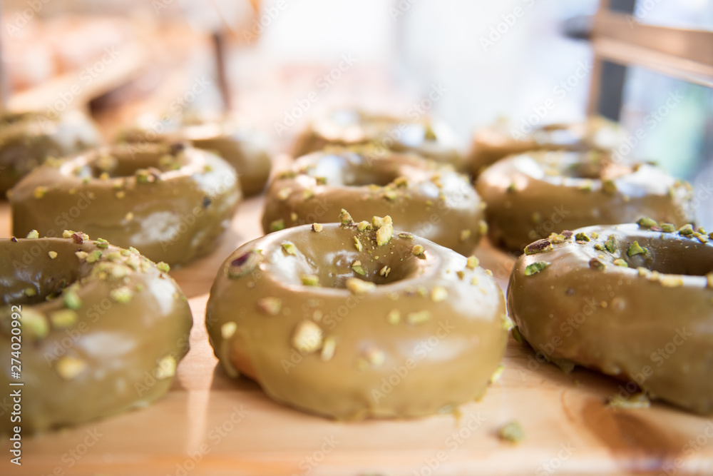 Brown donuts on a wooden plate
