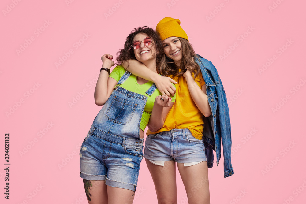 Fototapeta premium Cheerful teenager hugging best friend