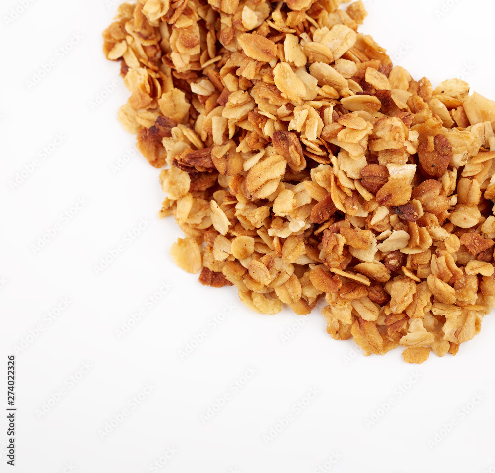 Organic homemade Granola Cereal with oats and almond. Texture oatmeal granola or muesli as background. Food concept. Healthy and wholesome food. Organic homemade Granola Cereal with oats and almond. Texture oatmeal granola or muesli as background. Food concept. Healthy and wholesome food.