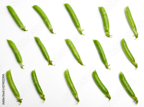 Fresh green pea pod with beans isolated on white background.