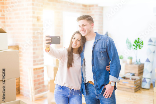 Beautiful young couple smiling happy taking a selfie photo with smartphone, very excited moving to a new home © Krakenimages.com