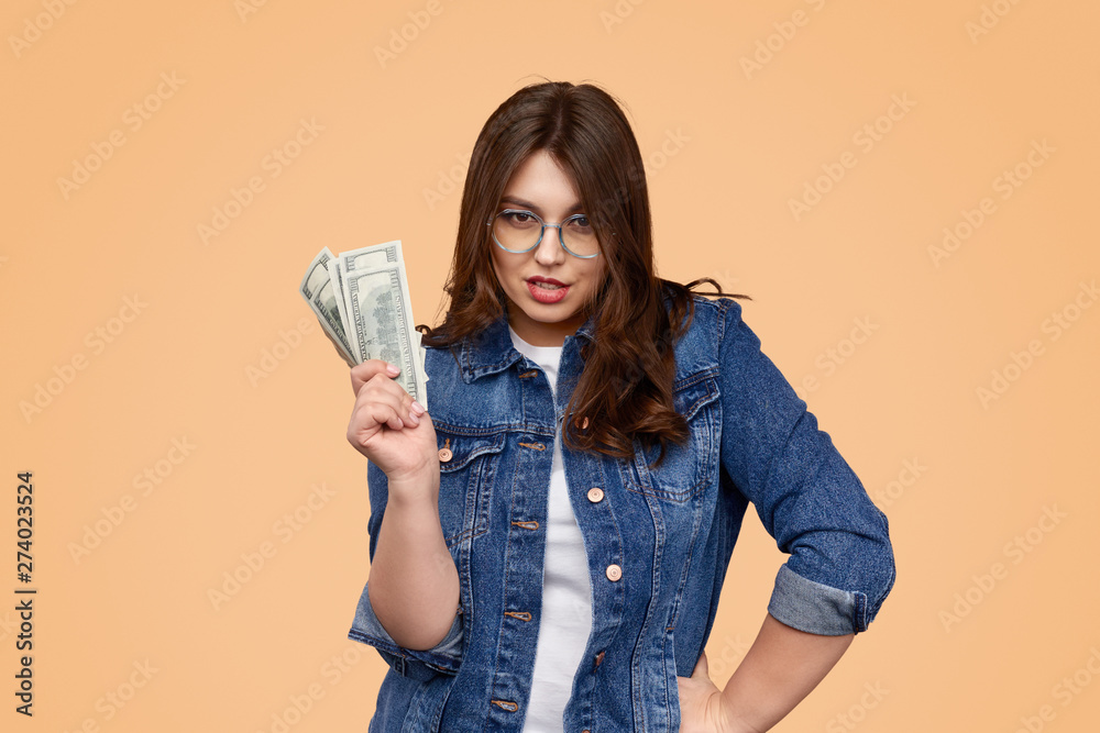 Confident overweight woman with money Confident overweight woman with money