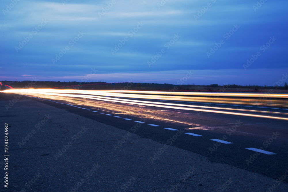 Night road and light from the headlights outside the city Night road and light from the headlights outside the city