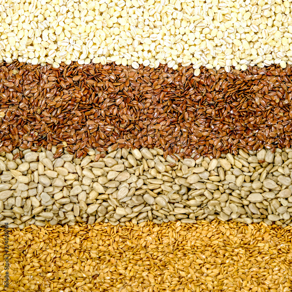 Obraz premium Brown Linseeds Golden Linseeds Sunflower Seeds Pearl Barley Healthy Superfood Seeds or Grain
