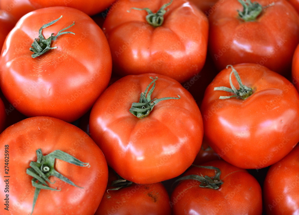 Red tomatoes background. Group of tomatoes. Full frame of cherry tomato on market. Red tomatoes background. Group of tomatoes. Full frame of cherry tomato on market.