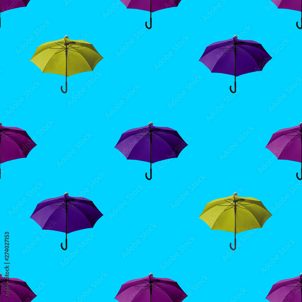 Seamless umbrella pattern Many colorful umbrellas on a bright blue background Photo print