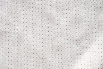 White fabric sport clothing football jersey with air mesh texture background