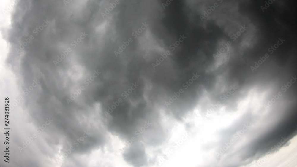 Black rain clouds moving rapidly across the sky. Black rain clouds moving rapidly across the sky.