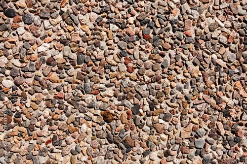 small stones in concrete wall