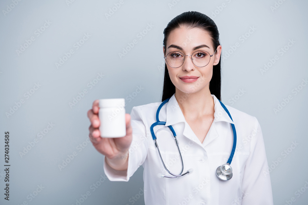 Close up photo beautiful she her lady doctor hospital showing pharmaceutical novelty analogues jar bottle wear phonendoscope white science costume specs eyeglasses eyewear isolated grey background Close up photo beautiful she her lady doctor hospital showing pharmaceutical novelty analogues jar bottle wear phonendoscope white science costume specs eyeglasses eyewear isolated grey background
